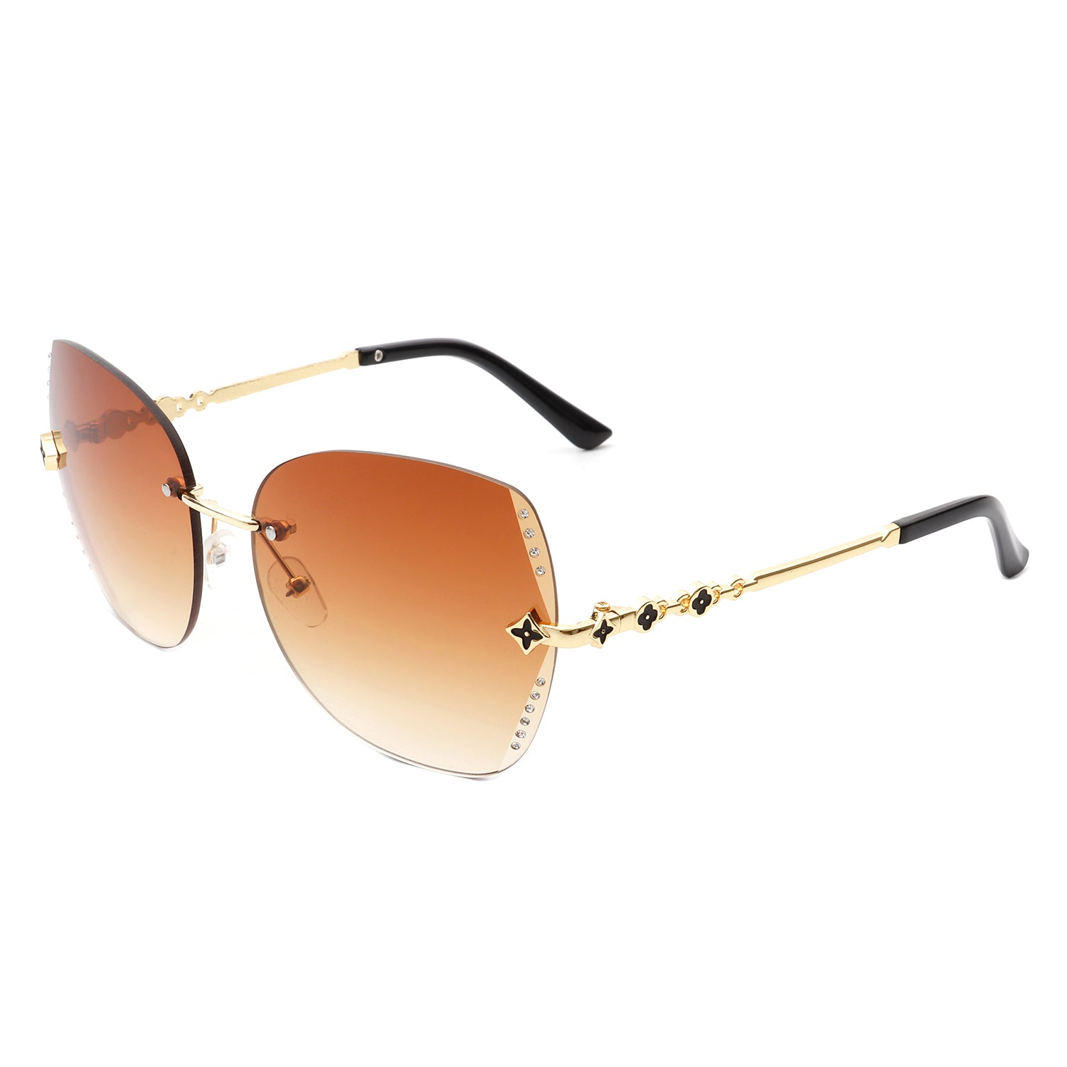 Kineticx Oversize Rimless Butterfly Sunglasses with tinted lenses and rhinestone accents, showcasing a stylish and glamorous design.
