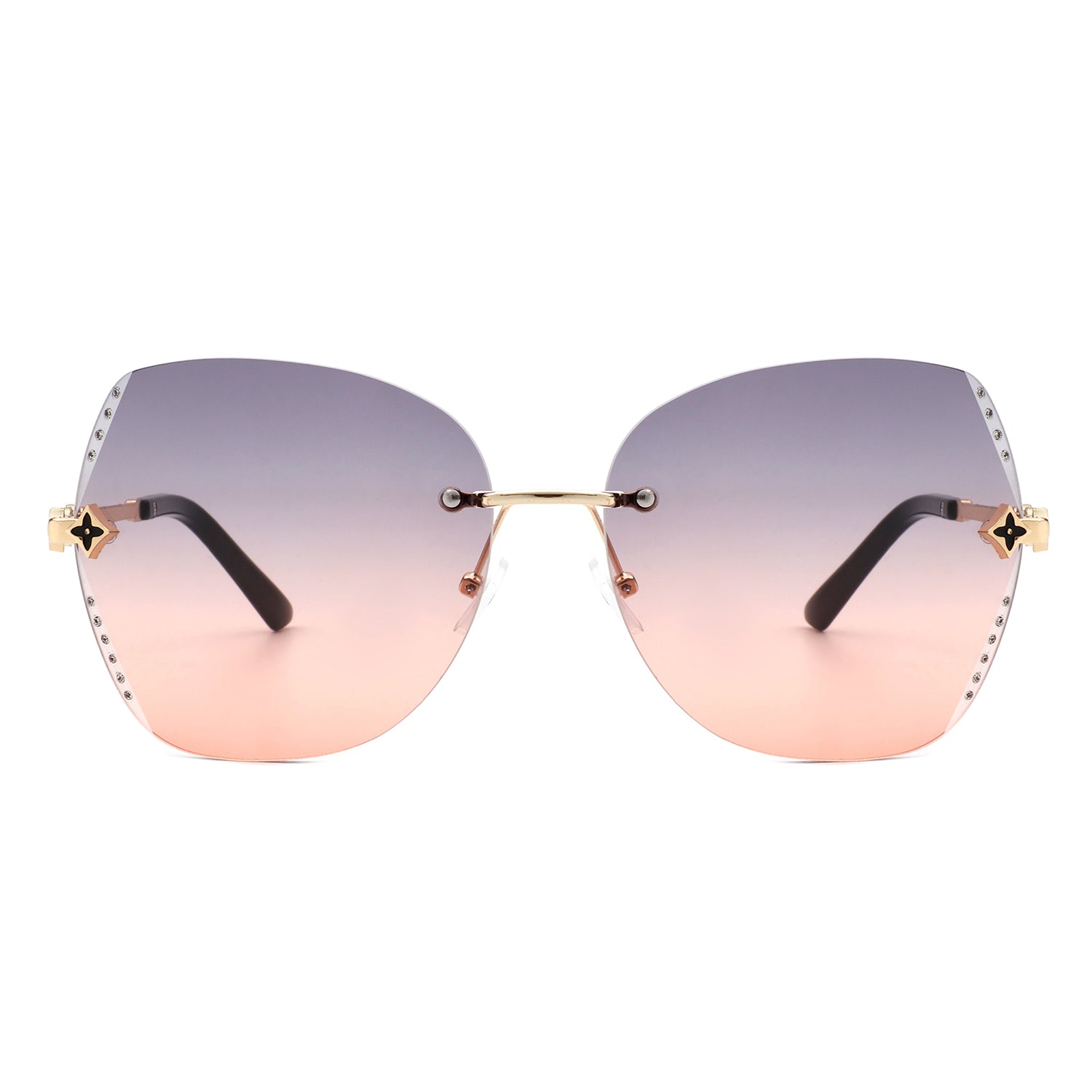 Kineticx Oversize Rimless Butterfly Sunglasses with tinted lenses and rhinestone accents, showcasing a stylish and glamorous design.