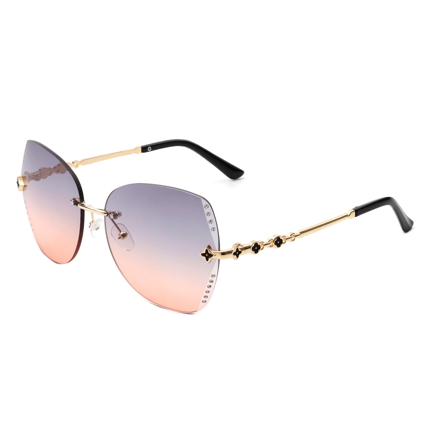 Kineticx Oversize Rimless Butterfly Sunglasses with tinted lenses and rhinestone accents, showcasing a stylish and glamorous design.
