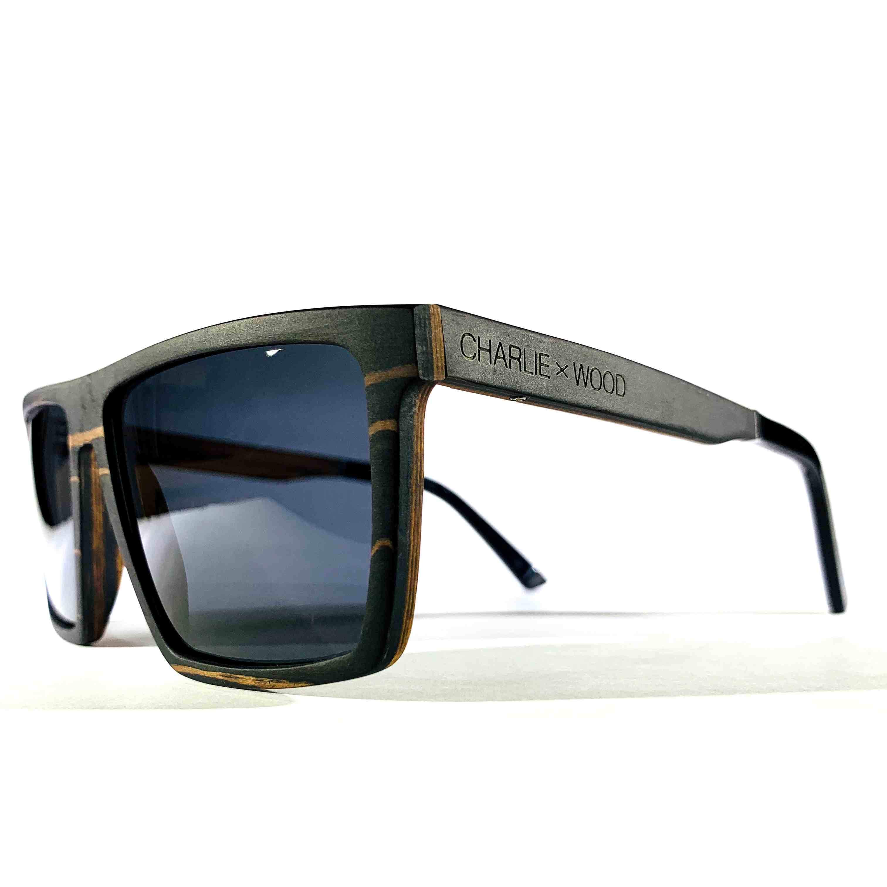 Kirkwood sunglasses featuring a stylish ebony wood frame and polarized grey lenses, perfect for outdoor activities.