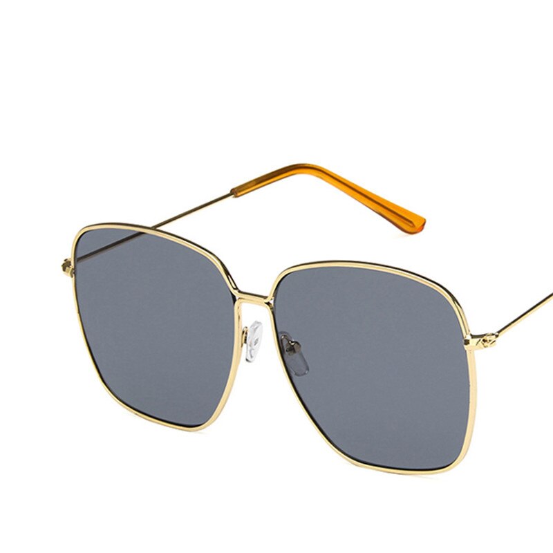 Large frame square sunglasses for women, showcasing a classic retro design with metal construction, perfect for street style.