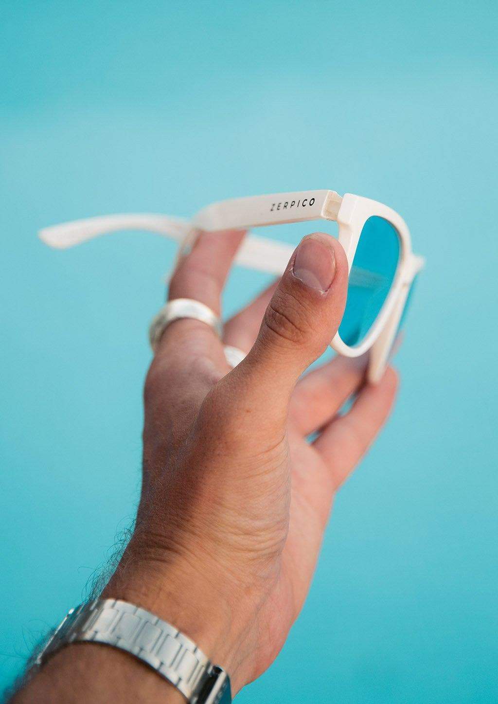 MOOD Wayfarer V2 - Husky sunglasses featuring a solid white frame and blue polarized lenses, perfect for stylish sun protection.