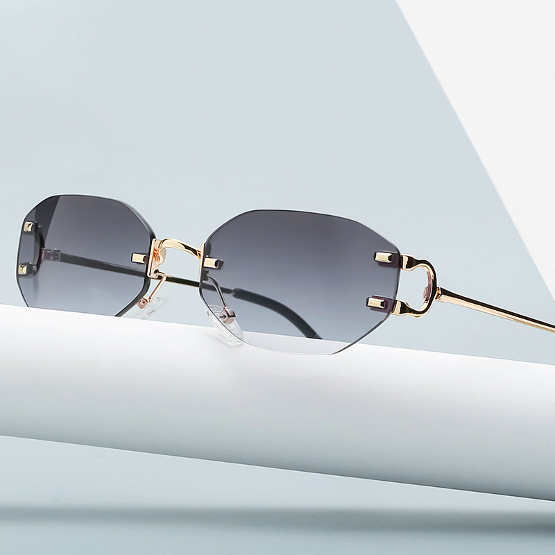 Stylish New Cut Edge Small Glasses with irregular polygon shape and gold metal frame, featuring gray lenses.