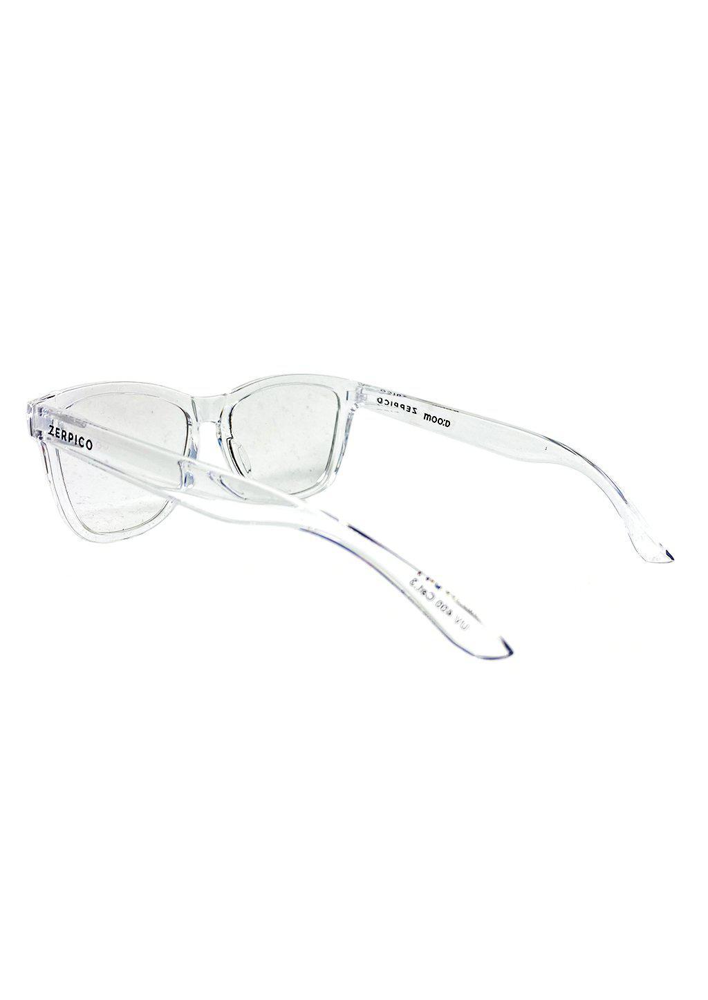 Nexus Bluelight Yang sunglasses demonstrating photochromic lenses transitioning from clear indoors to dark outdoors.