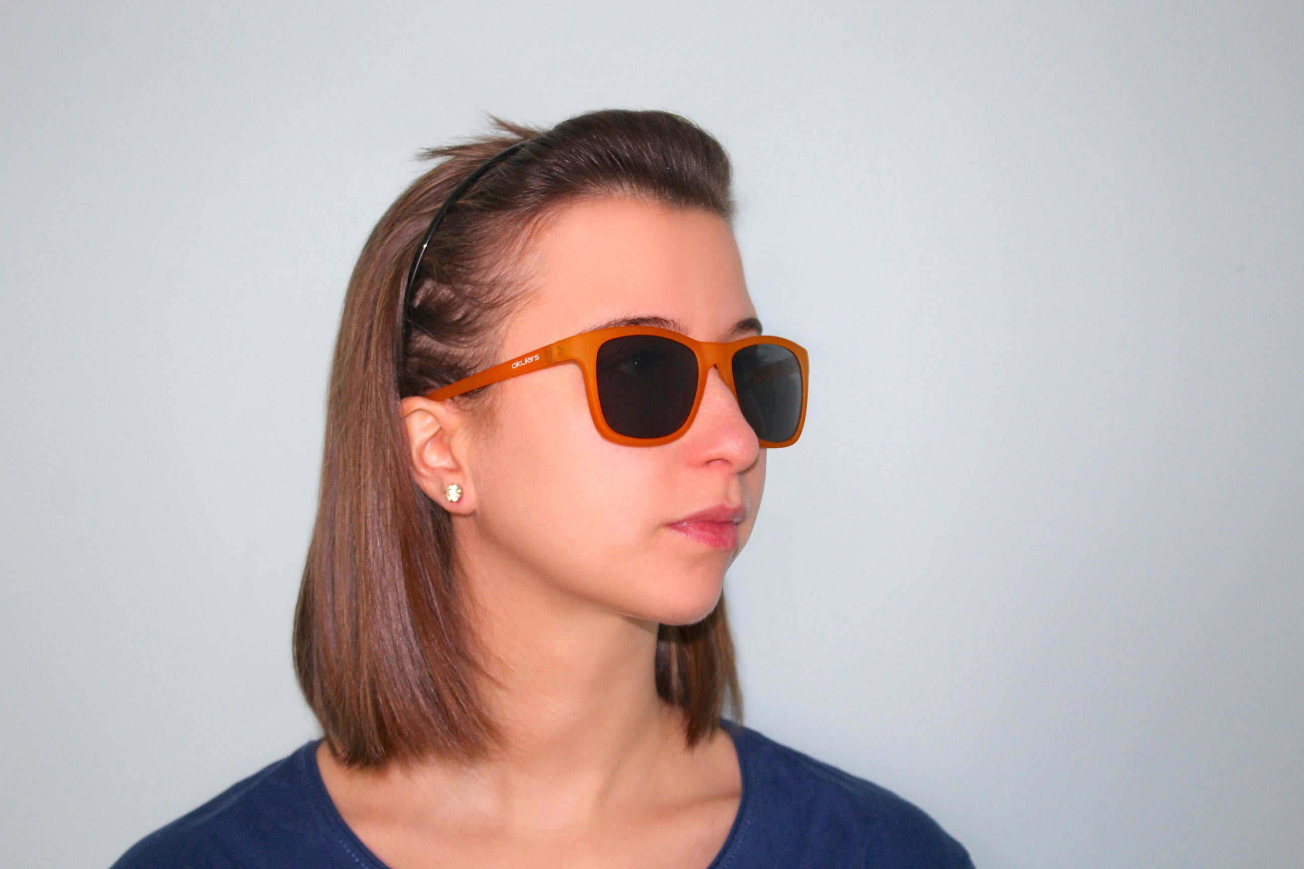 Okulars Eco Nordic Amber Black sunglasses with a matte finish, showcasing a stylish design made from recycled materials.