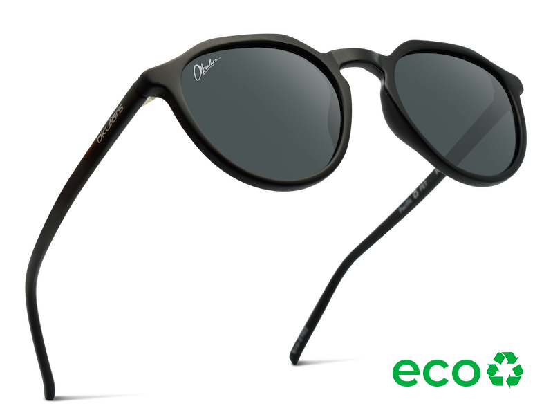 Okulars Eco Pacific Black sunglasses with a sleek matte finish, made from recycled materials, displayed on a neutral background.