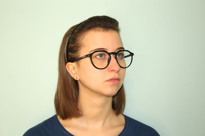 Okulars Eco Pacific Luce Blu in black, made from 100% recycled materials, displayed with a soft-touch matte finish and microfiber case.