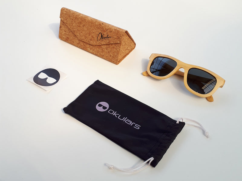 Okulars® Natural Bamboo sunglasses in Coal Black, featuring a lightweight bamboo frame and polarized lenses, displayed elegantly.