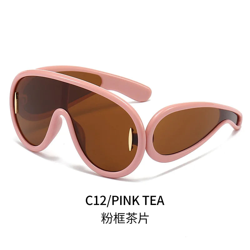 A pair of stylish oversized punk sunglasses designed for women, featuring a retro cycling style and UV400 lens protection.