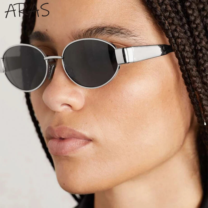 Stylish oval sunglasses from Sexikinis Swim, featuring a vintage design and UV protection, suitable for outdoor activities.