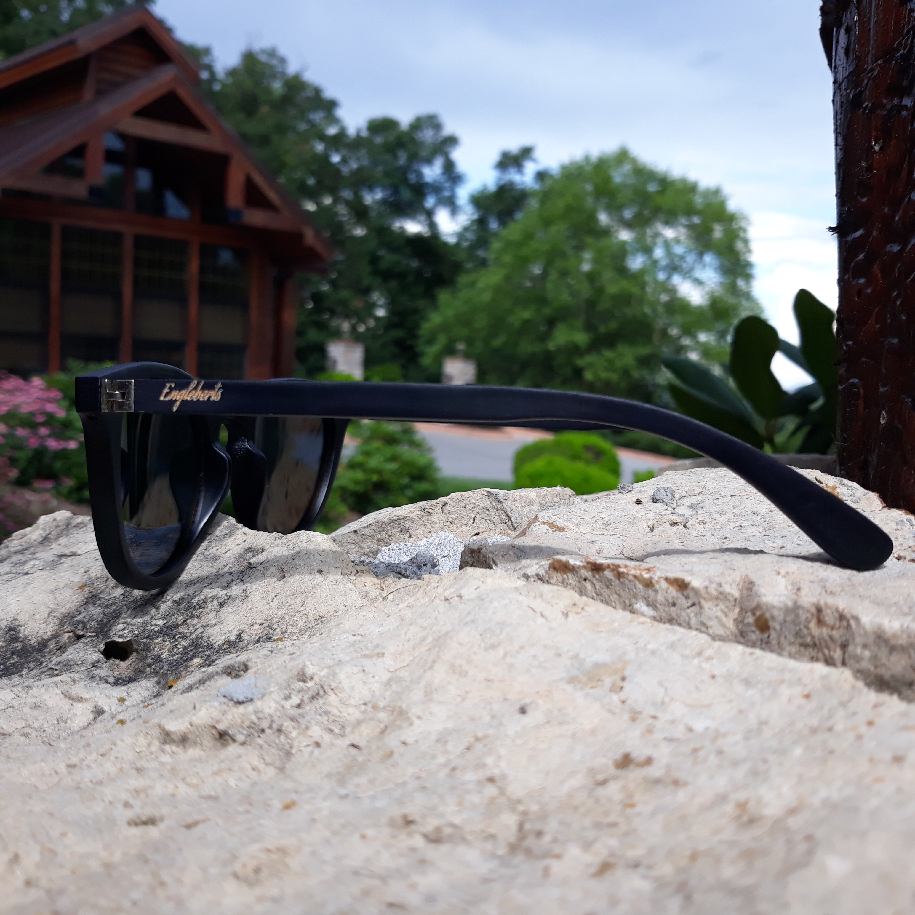 Engleberts Sunset Mirror Lenses Polarized sunglasses with black bamboo frame and protective case, showcasing stylish design and eco-friendly materials.