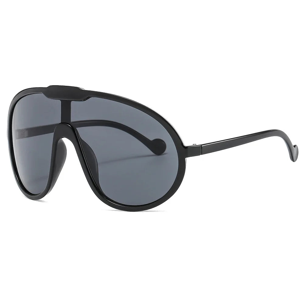 Vintage One Piece Champagne Sunglasses with a stylish shield design, featuring a durable plastic frame and UV400 lenses for eye protection.