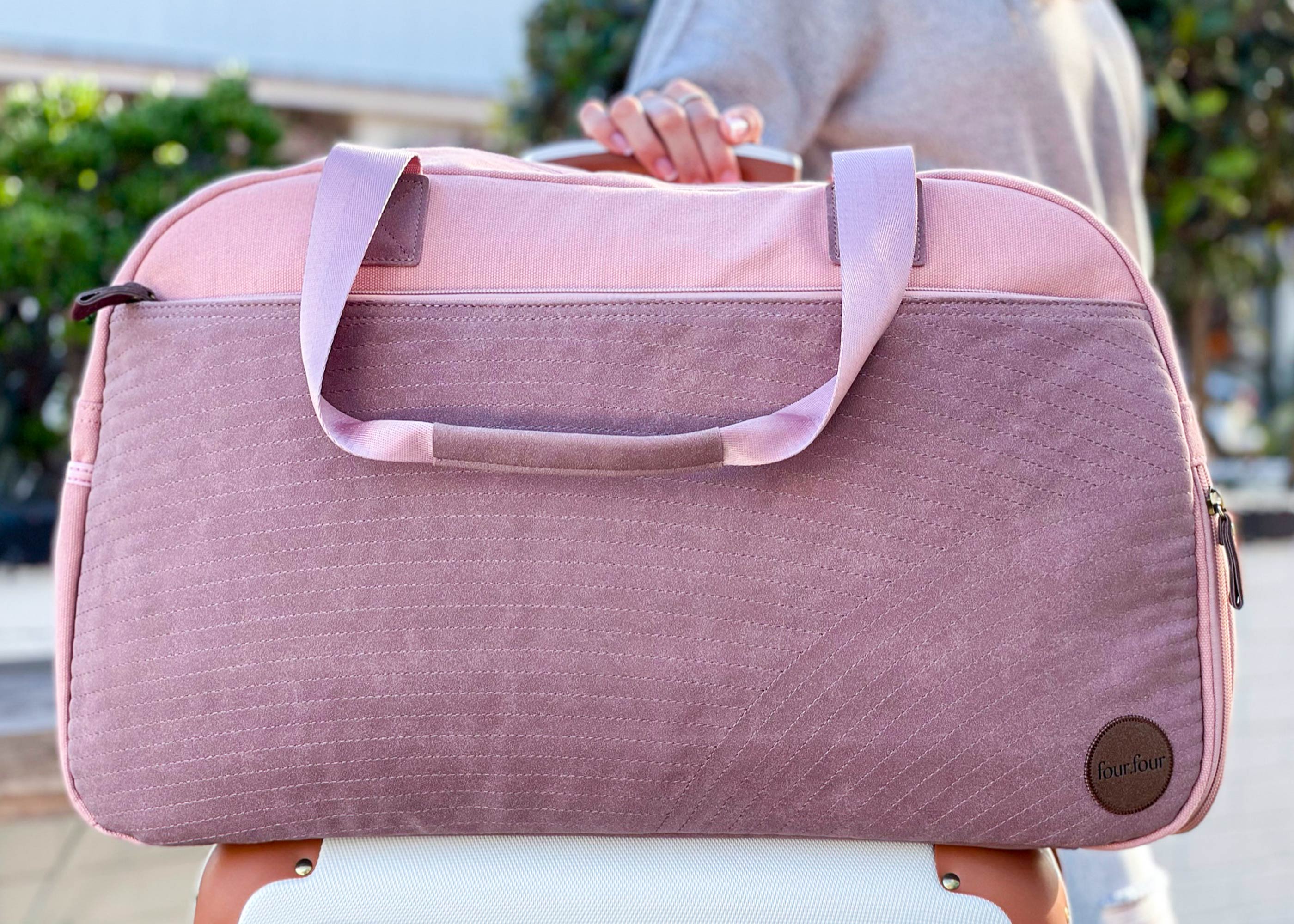 Getaway Duffel Bag in Sittin' Pretty Pink, featuring stylish design and multiple compartments for travel organization.