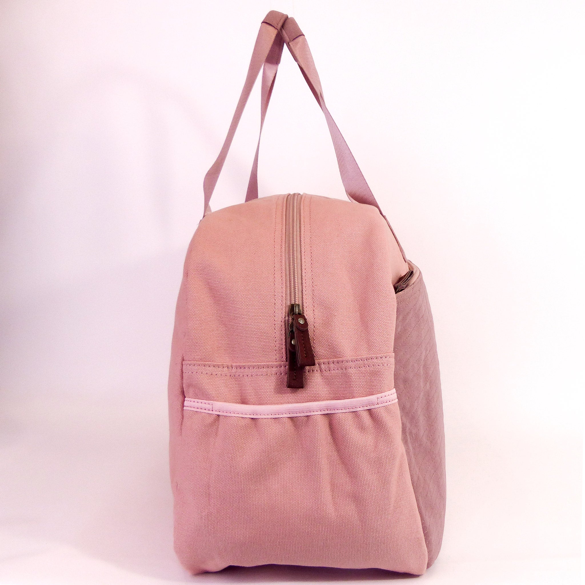Getaway Duffel Bag in Sittin' Pretty Pink, featuring stylish design and multiple compartments for travel organization.