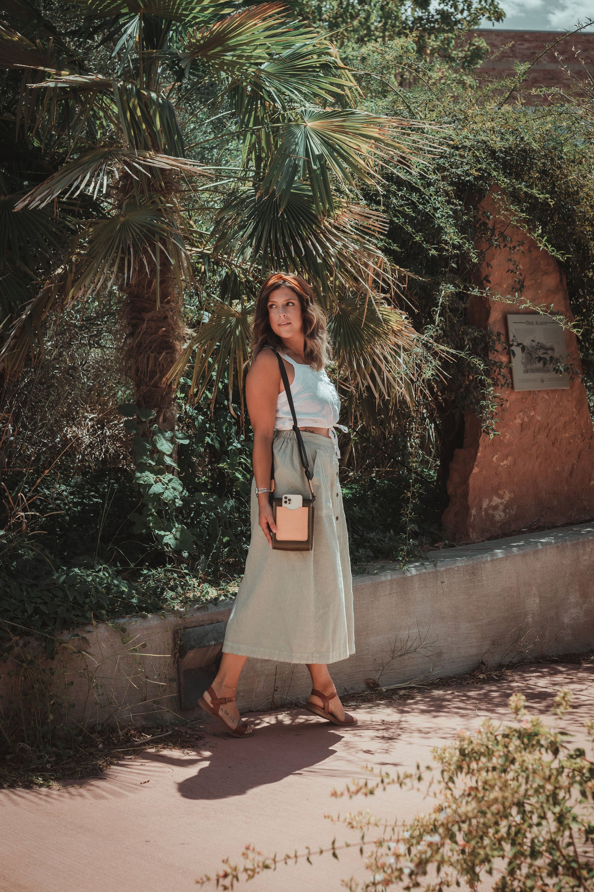 Giramondo Leather Crossbody Bag in Olive and Natural colors, showcasing full grain leather and matte black hardware.