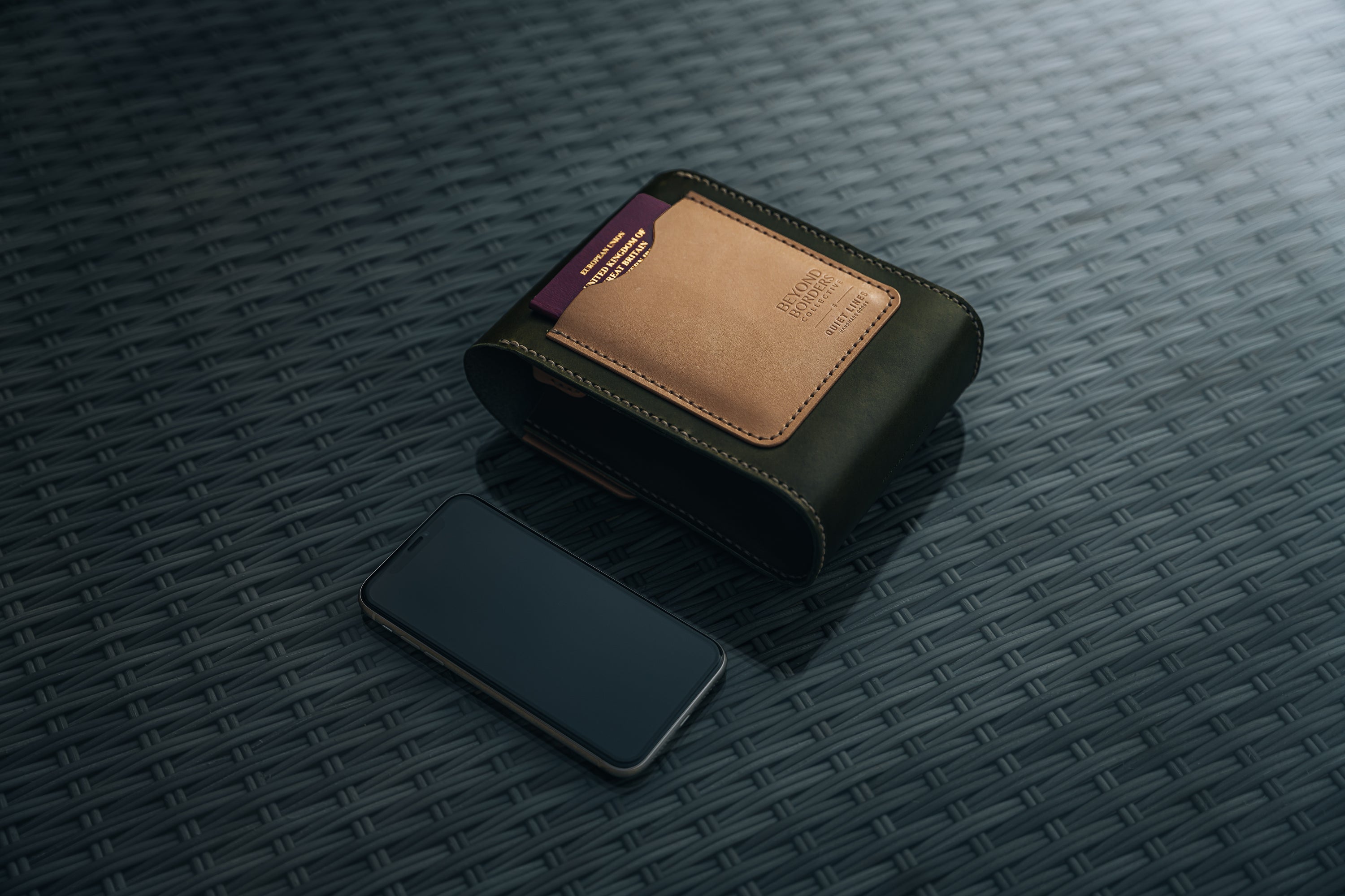 Giramondo Leather Crossbody Bag in Olive and Natural colors, showcasing full grain leather and matte black hardware.