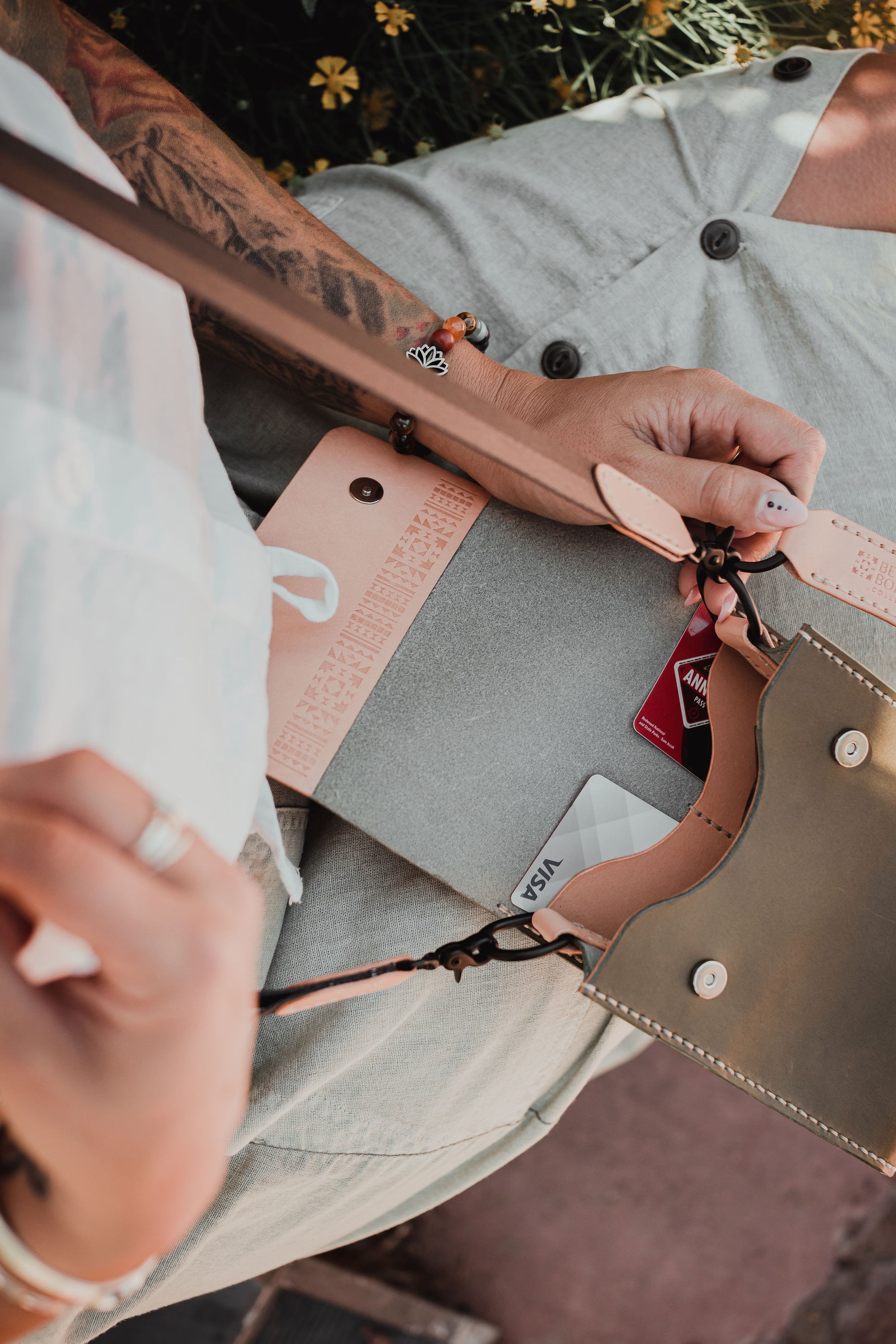 Giramondo Leather Crossbody Bag in Olive and Natural colors, showcasing full grain leather and matte black hardware.