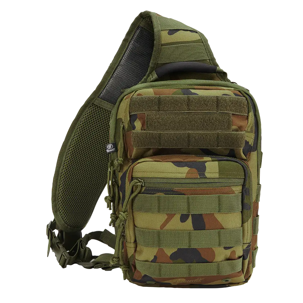 US Cooper Every Day Carry Sling shoulder bag in black, showcasing its durable polyester fabric, adjustable strap, and multiple pockets for organization.