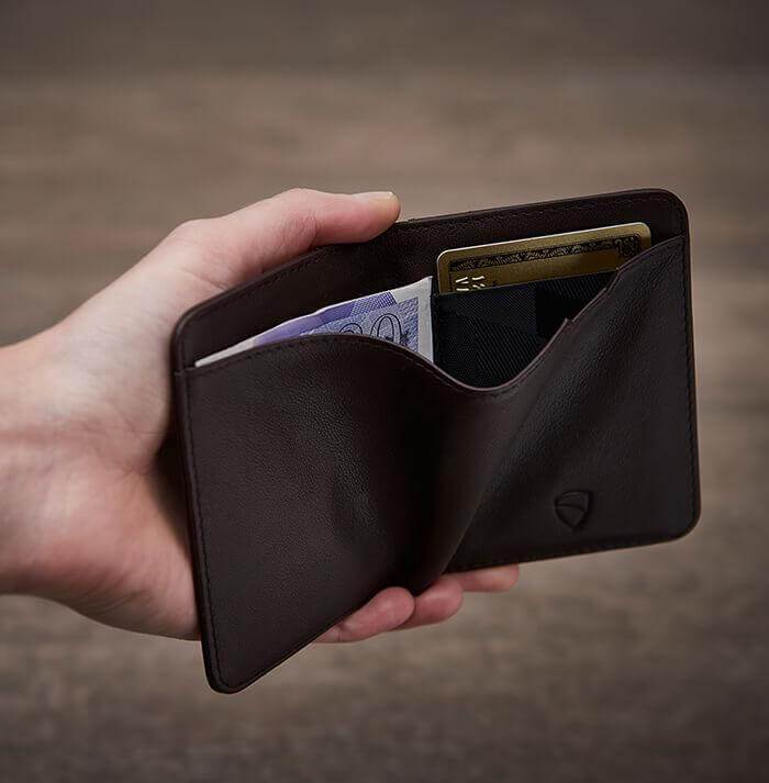 CITY Wallet made of luxurious Italian leather, featuring a slim design and RFID-blocking technology, perfect for secure card storage.