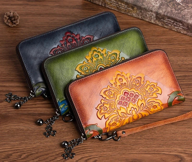 Floral Embossed Leather Wallet showcasing intricate floral patterns and a zipper closure, made from high-quality cowhide leather.