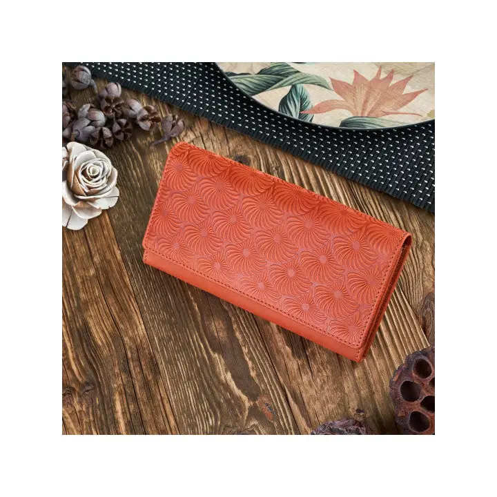Natural leather women's wallet in red, green, and orange with geometric embossed pattern and compartments for cards and cash.