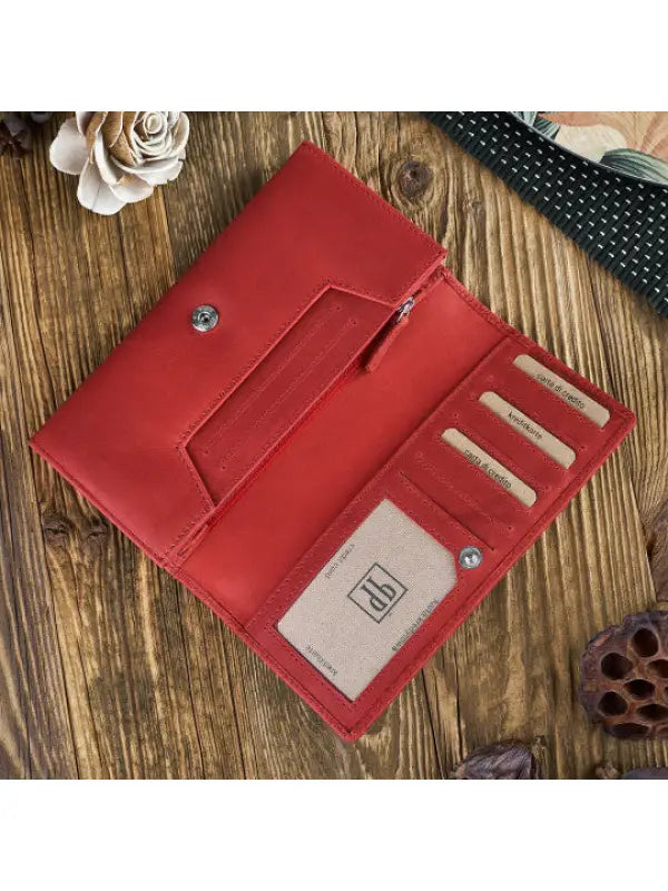 Natural leather women's wallet in red, green, and orange with geometric embossed pattern and compartments for cards and cash.