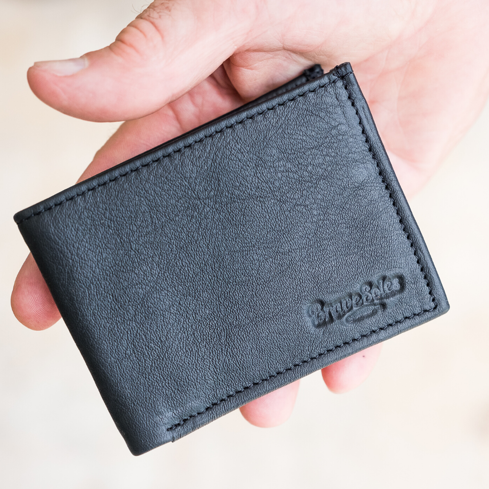 The Michel Bifold Leather Wallet showcasing its minimalist design, made from locally sourced leather and featuring recycled tire tube pockets.