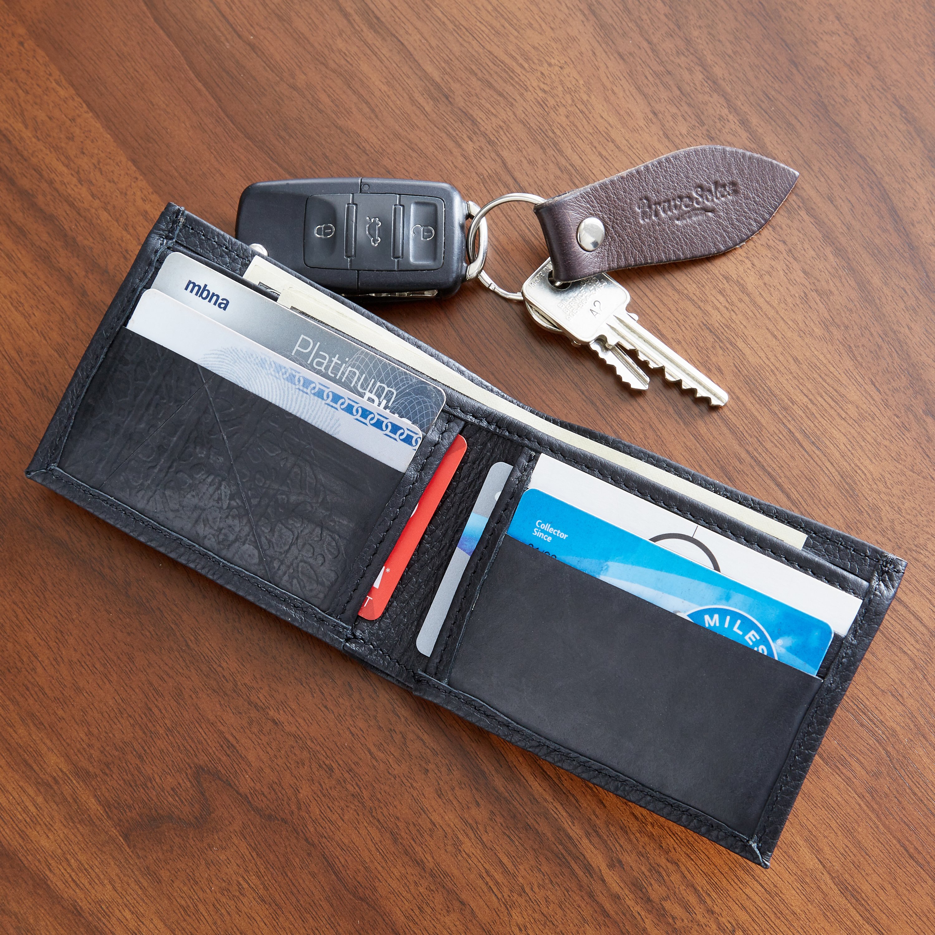 The Michel Bifold Leather Wallet showcasing its minimalist design, made from locally sourced leather and featuring recycled tire tube pockets.