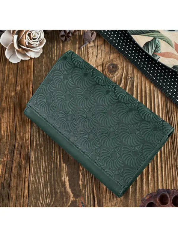 A vibrant and chic leather women's wallet showcasing premium leather craftsmanship, featuring a zipper and magnetic snap closure.