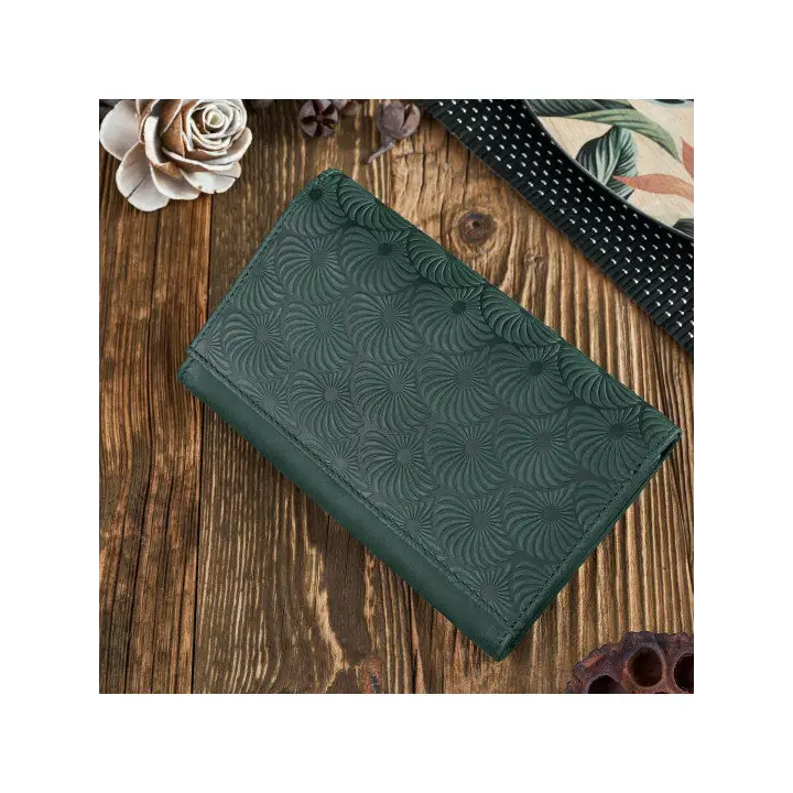 A vibrant and chic leather women's wallet showcasing premium leather craftsmanship, featuring a zipper and magnetic snap closure.