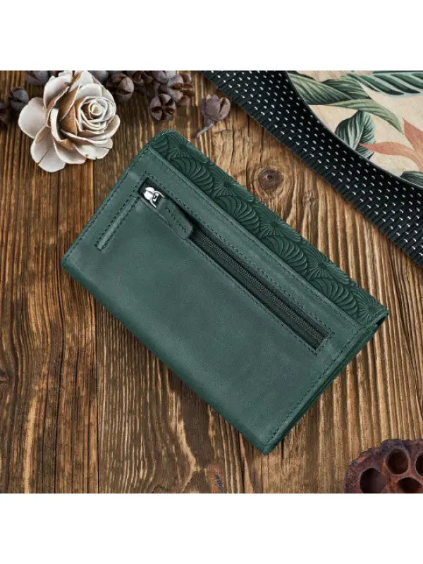 A vibrant and chic leather women's wallet showcasing premium leather craftsmanship, featuring a zipper and magnetic snap closure.