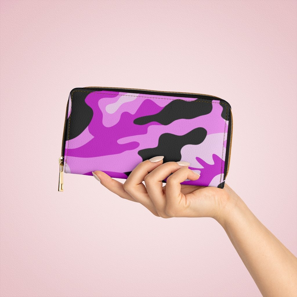 Stylish pink camo womens wallet made of faux leather with zip closure and multiple pockets.