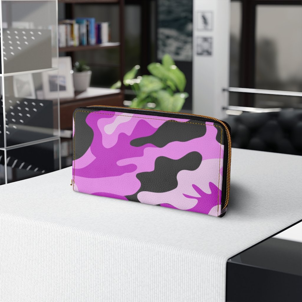 Stylish pink camo womens wallet made of faux leather with zip closure and multiple pockets.
