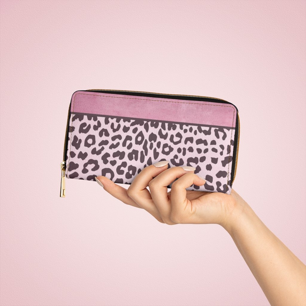 Stylish pink leopard zip wallet for women, featuring multiple pockets and gold stitching.