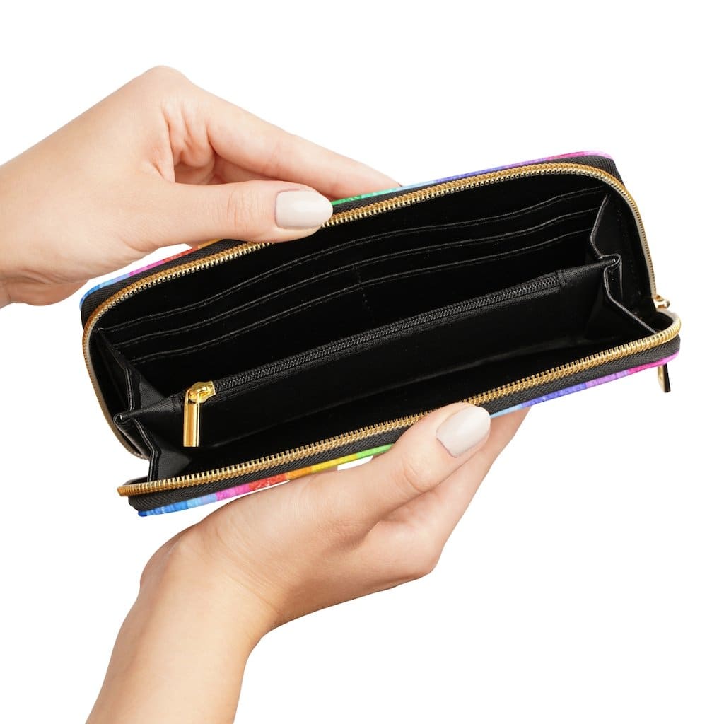 Colorful women's zip wallet featuring a rainbow stripe pastel design, made from cruelty-free faux leather with gold stitching.