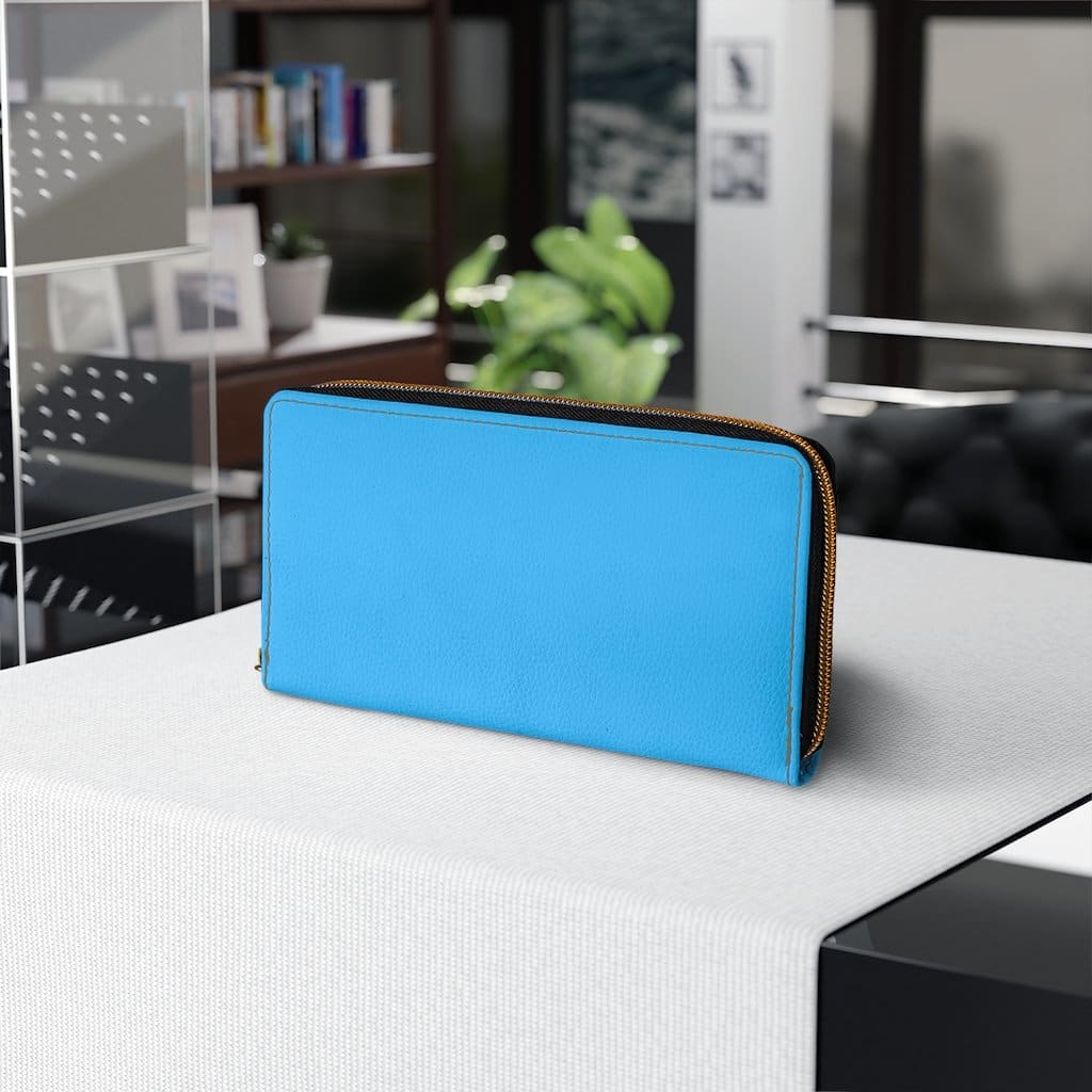 A vibrant blue women's zip wallet made of faux leather, featuring gold stitching and multiple pockets for cards and cash.