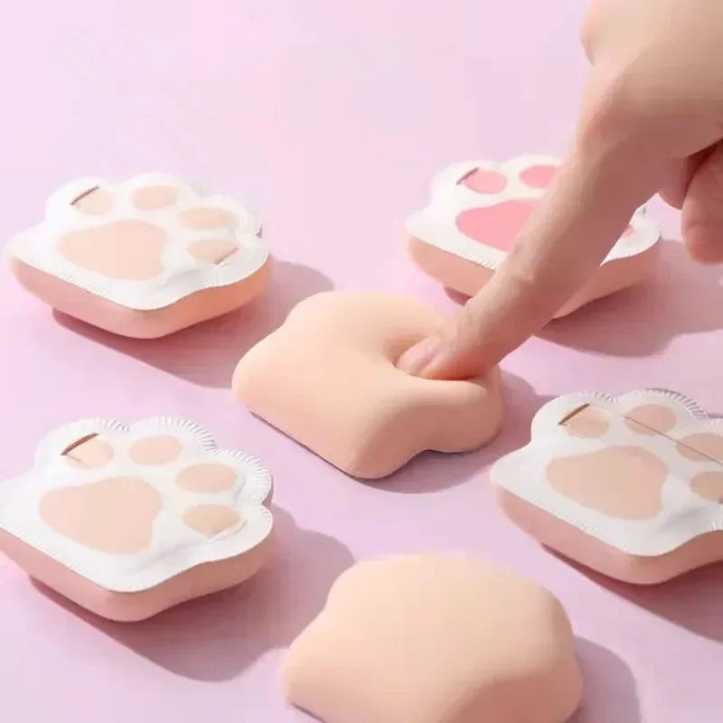 Three cute cat claw makeup sponges in pastel colors, designed for applying foundation and powder.