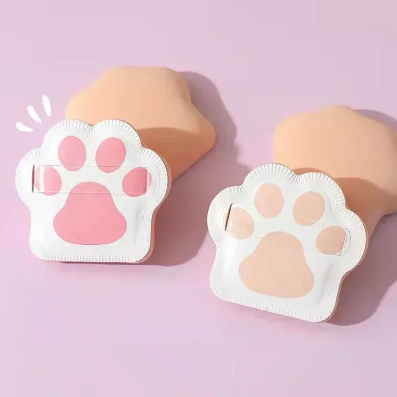 Three cute cat claw makeup sponges in pastel colors, designed for applying foundation and powder.