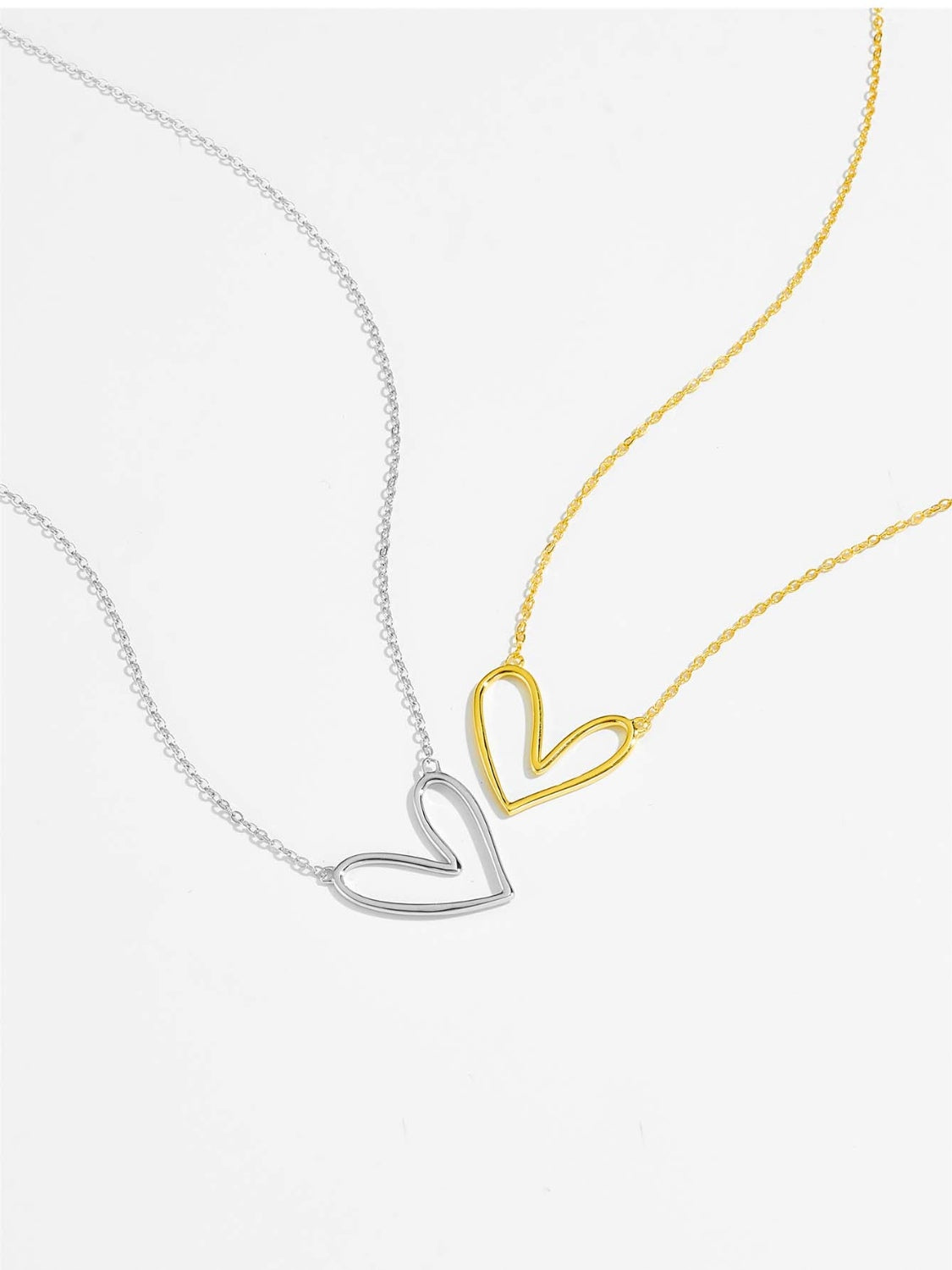 A delicate 925 sterling silver heart pendant necklace with a platinum and 18K gold plating, showcasing its elegant design.