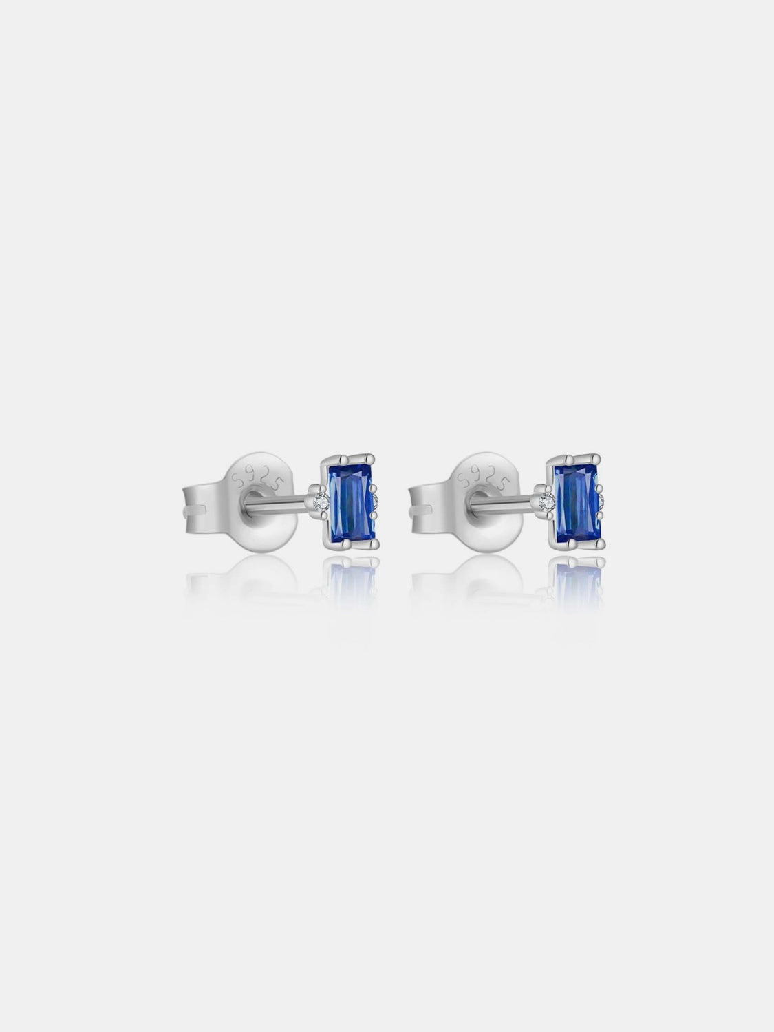 A pair of elegant 925 sterling silver stud earrings featuring sparkling zircon stones, showcasing their luxurious design and quality craftsmanship.