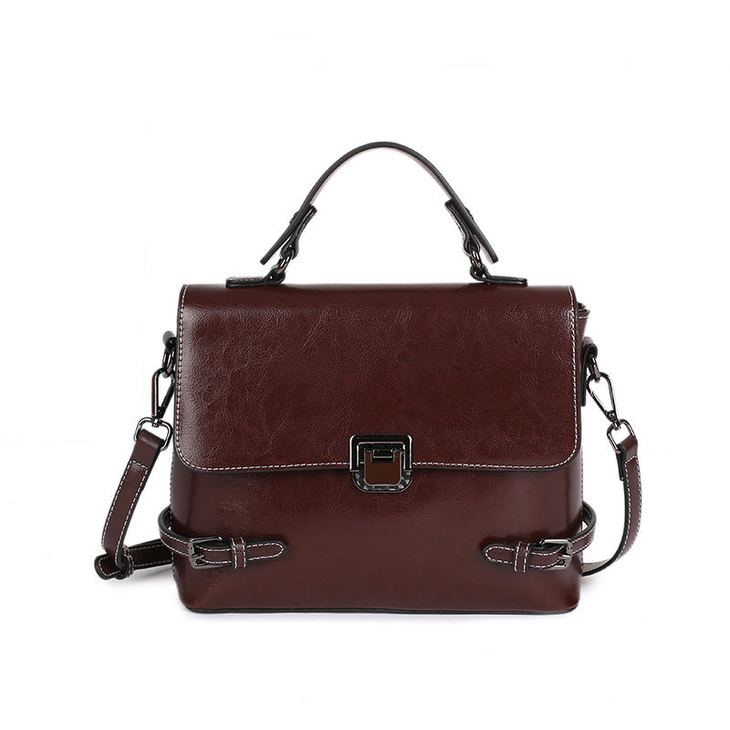All-Match Leather Urban Simplicity Messenger Bag for Ladies, crafted from first layer cowhide, featuring a detachable handle and multiple pockets.