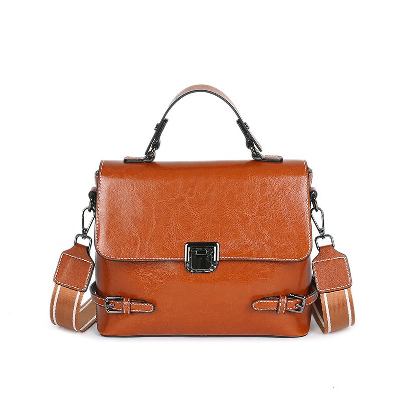 All-Match Leather Urban Simplicity Messenger Bag for Ladies, crafted from first layer cowhide, featuring a detachable handle and multiple pockets.
