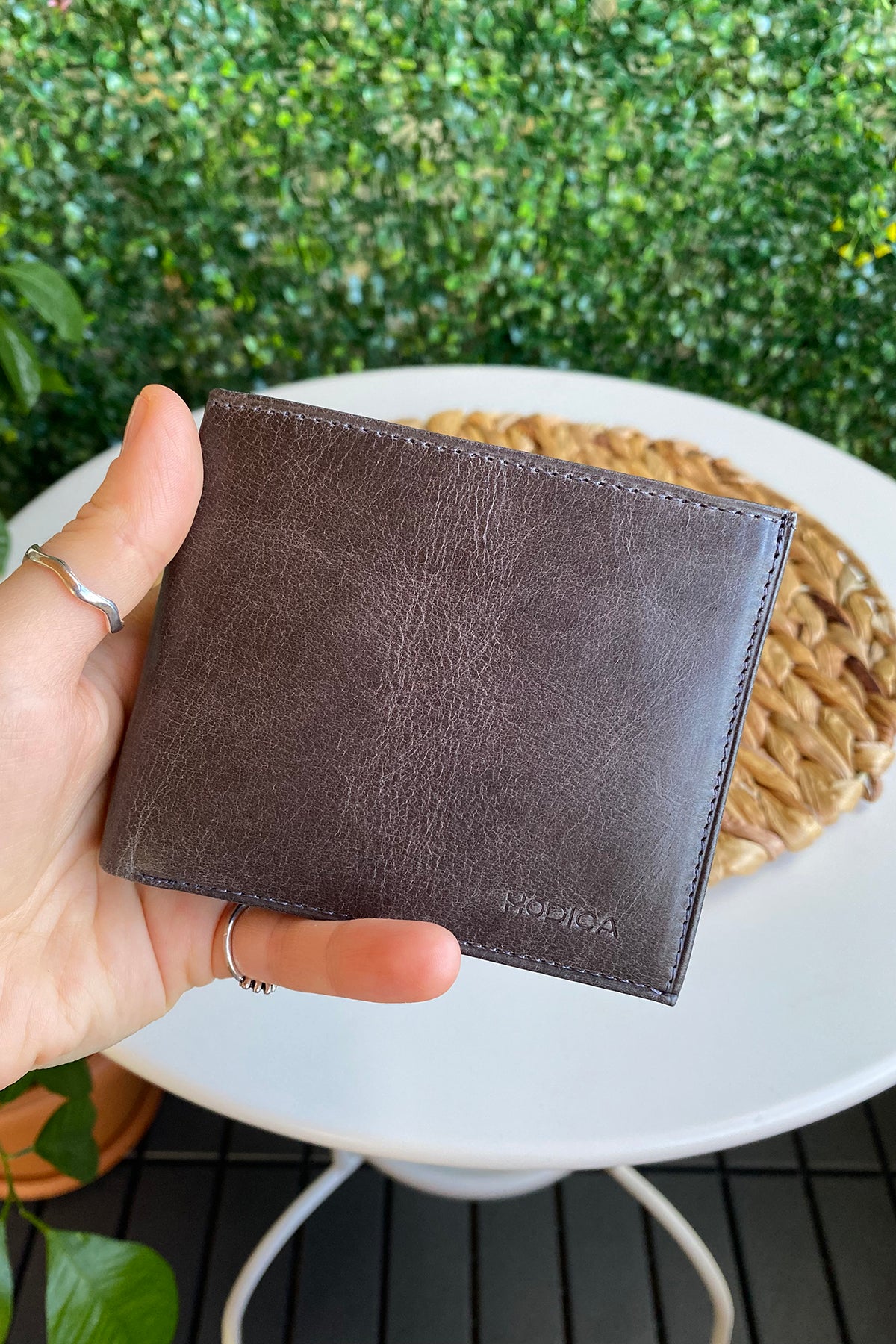 Atlanta Genuine Leather Trifold Wallet in various colors with coin pouch compartment, showcasing its sleek design and high-quality leather.
