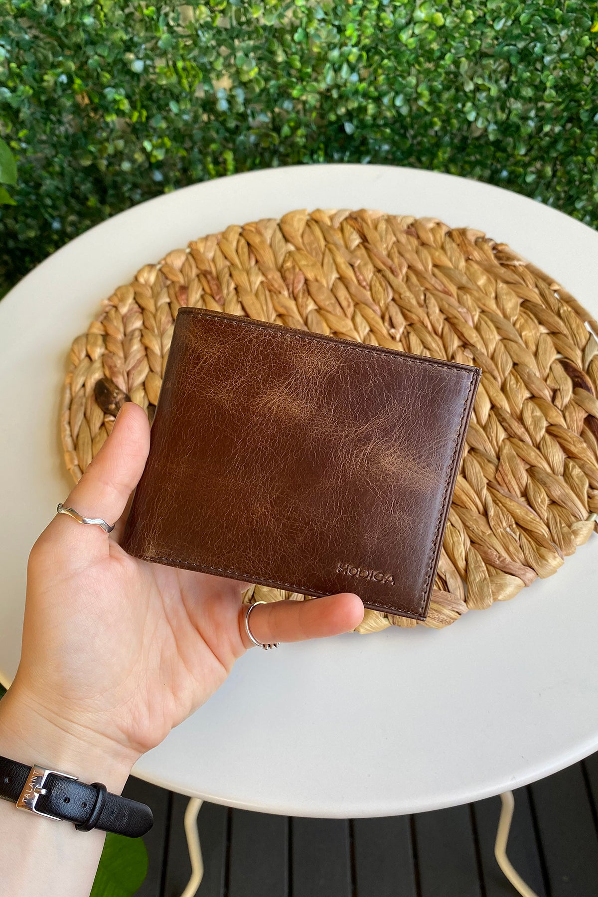 Atlanta Genuine Leather Trifold Wallet in various colors with coin pouch compartment, showcasing its sleek design and high-quality leather.