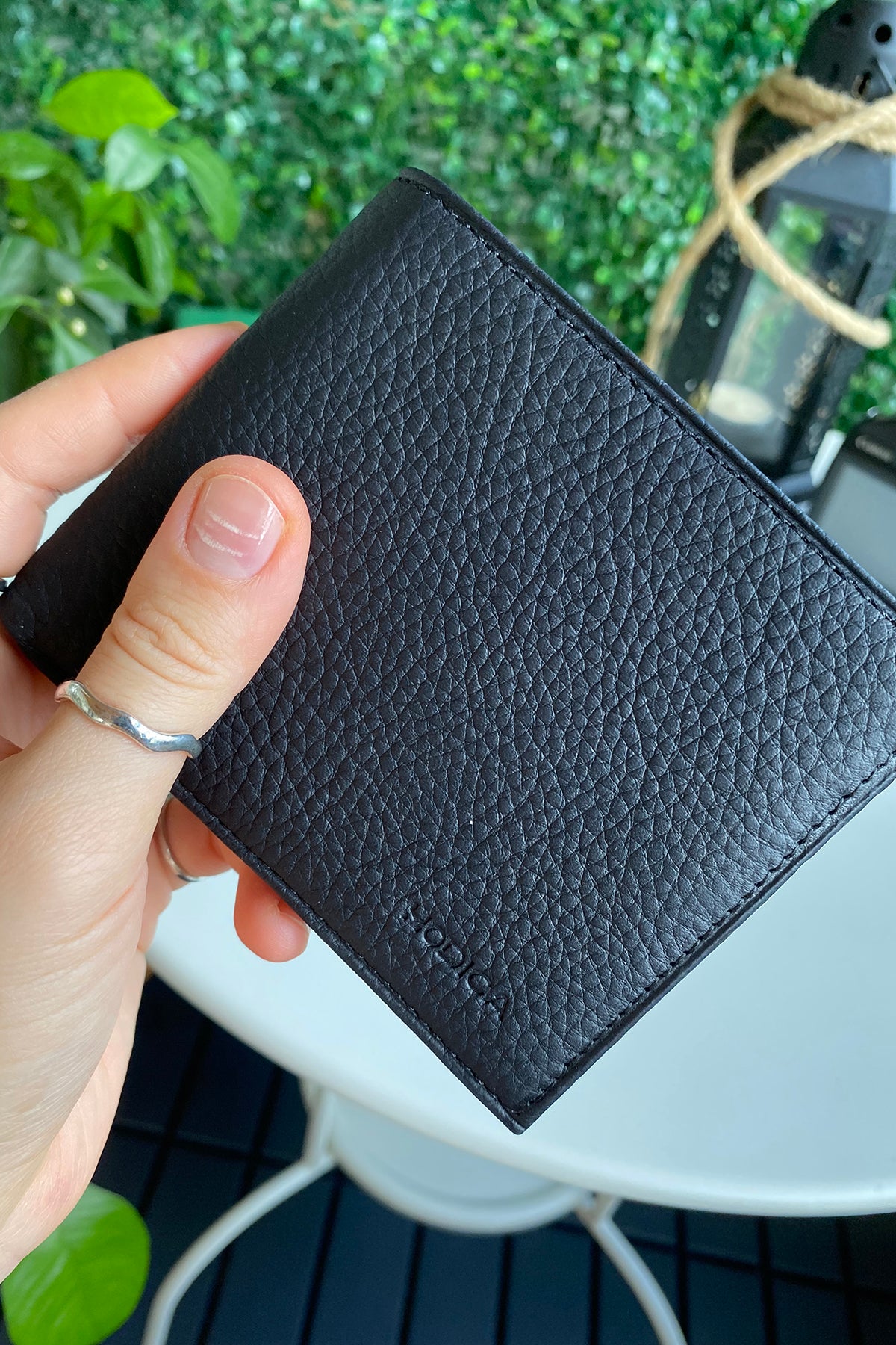 Atlanta Genuine Leather Trifold Wallet in various colors with coin pouch compartment, showcasing its sleek design and high-quality leather.