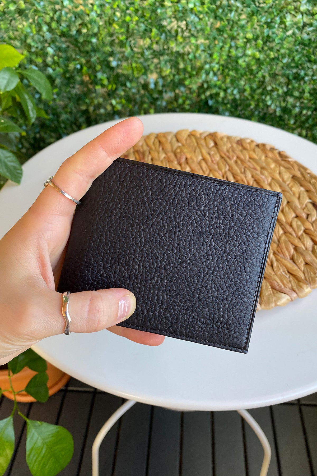 Atlanta Genuine Leather Trifold Wallet in various colors with coin pouch compartment, showcasing its sleek design and high-quality leather.