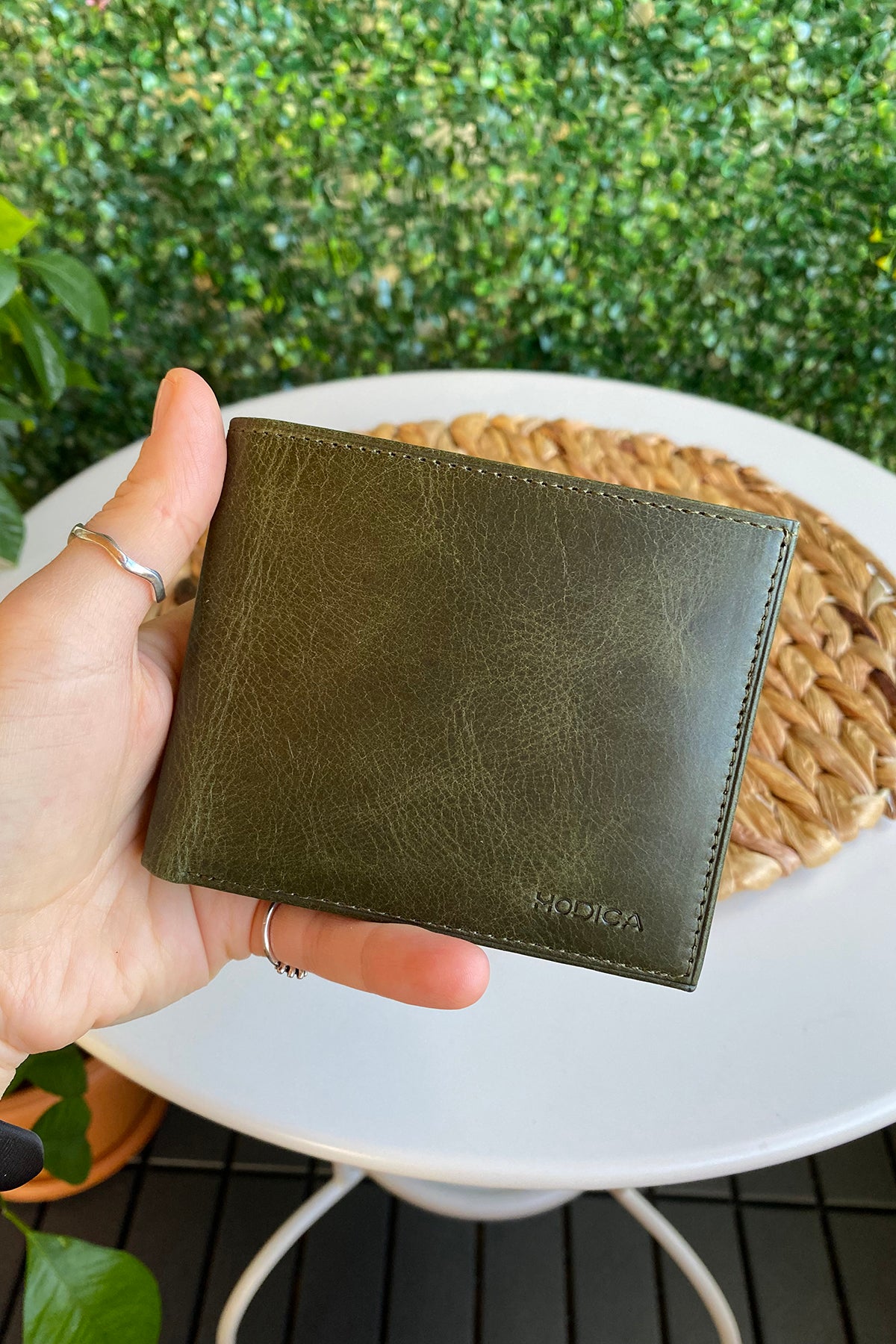 Atlanta Genuine Leather Trifold Wallet in various colors with coin pouch compartment, showcasing its sleek design and high-quality leather.
