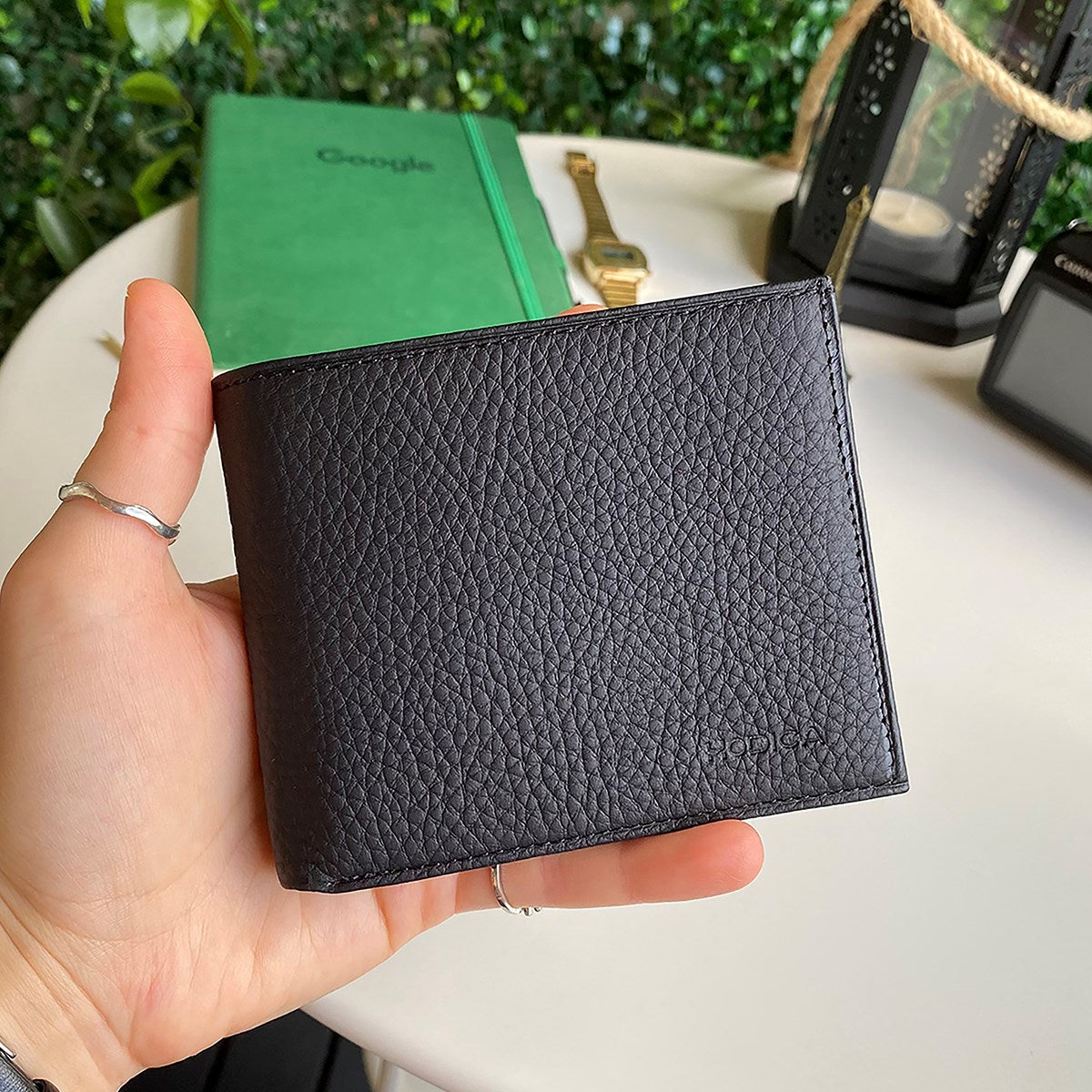 Atlanta Genuine Leather Trifold Wallet in various colors with coin pouch compartment, showcasing its sleek design and high-quality leather.