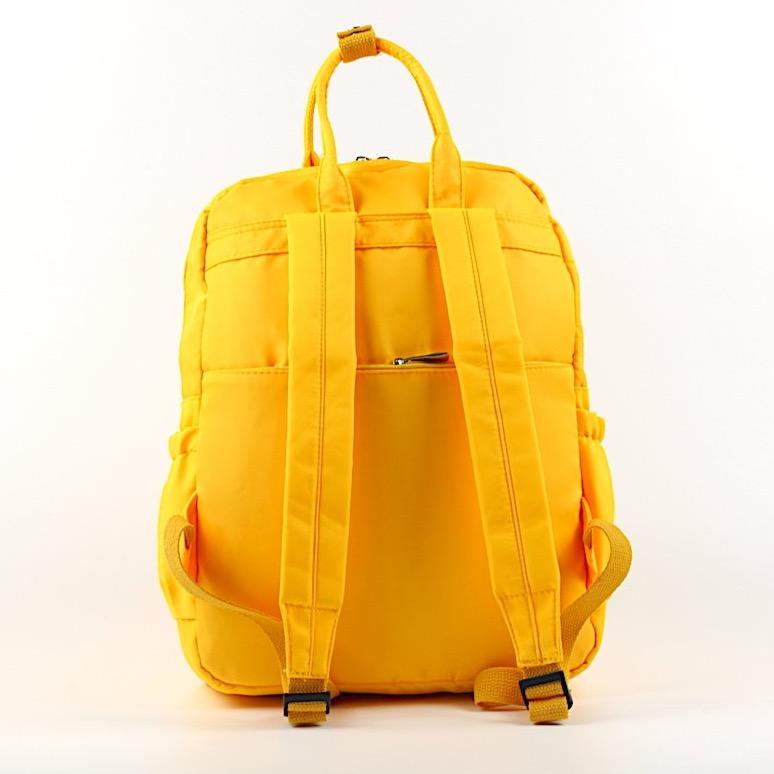 Stylish waterproof nylon backpack for work and university with iPad pocket and multiple zipped compartments.