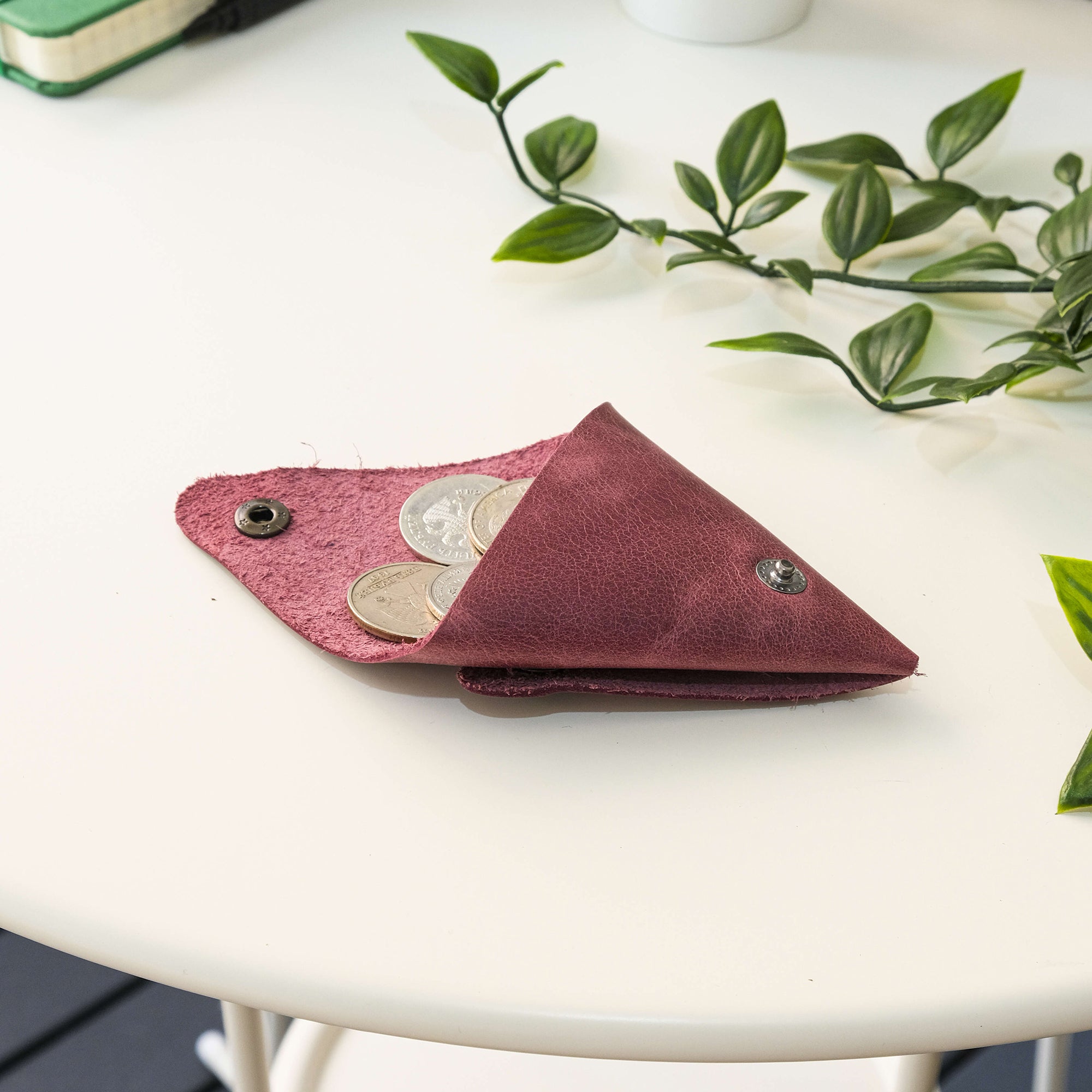 Bamby Genuine Leather Coin Pouch in various colors, showcasing its minimalist and stitchless design.